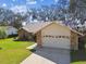 Single-story home with stone facade and two-car garage at 9142 Brooker Dr, New Port Richey, FL 34655