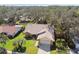 Aerial view of a single-Gathering home with a large yard at 9142 Brooker Dr, New Port Richey, FL 34655