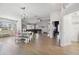 Bright dining room with farmhouse table and hardwood floors at 9142 Brooker Dr, New Port Richey, FL 34655