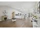 Open living room with hardwood floors and a view into the kitchen at 9142 Brooker Dr, New Port Richey, FL 34655
