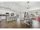Open concept kitchen with island, stainless steel appliances, and hardwood floors at 9142 Brooker Dr, New Port Richey, FL 34655