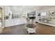 Modern white kitchen with an island and breakfast bar at 9142 Brooker Dr, New Port Richey, FL 34655