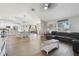 Open concept living room with hardwood floors and sectional sofa at 9142 Brooker Dr, New Port Richey, FL 34655