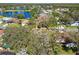Aerial view of a lakefront community and surrounding landscape at 9142 Brooker Dr, New Port Richey, FL 34655