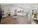 Open concept living room and kitchen with hardwood floors at 9142 Brooker Dr, New Port Richey, FL 34655