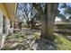 Large backyard with mature trees and a screened porch at 9142 Brooker Dr, New Port Richey, FL 34655