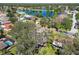 Aerial view of home near a lake, showcasing the neighborhood and landscape at 9142 Brooker Dr, New Port Richey, FL 34655