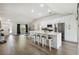 Open concept kitchen featuring white cabinets, stainless steel appliances and breakfast bar at 9142 Brooker Dr, New Port Richey, FL 34655