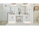 Double vanity bathroom with a large walk-in shower at 11313 Limpkin Rd, Weeki Wachee, FL 34614