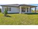Newly built home with covered patio and spacious backyard at 11313 Limpkin Rd, Weeki Wachee, FL 34614