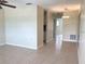 Open concept living area with view into kitchen at 11200 86Th Ave # 204, Seminole, FL 33772