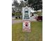 Seminole Gardens community bus stop and neighborhood watch sign at 11200 86Th Ave # 204, Seminole, FL 33772