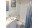 Updated bathroom with white vanity, tub, and patterned floor at 11200 86Th Ave # 204, Seminole, FL 33772