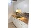White kitchen with butcher block countertops at 11200 86Th Ave # 204, Seminole, FL 33772