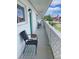 Shared hallway with teal doors and American flag, offering a community view at 11200 86Th Ave # 204, Seminole, FL 33772