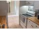 Bright kitchen features light wood cabinets and countertops, and a modern electric range at 11200 86Th Ave # 204, Seminole, FL 33772