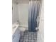 Updated bathroom with white vanity, tub, and patterned floor at 11200 86Th Ave # 204, Seminole, FL 33772