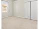 Large bedroom with neutral carpeting and double door closet at 4264 Braemere Dr, Spring Hill, FL 34609