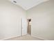 Spacious bedroom with neutral walls and access to bathroom at 4264 Braemere Dr, Spring Hill, FL 34609