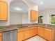 Kitchen features granite countertops, light wood cabinets, and a double sink at 4264 Braemere Dr, Spring Hill, FL 34609