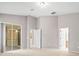 Primary bedroom with neutral walls, carpet, and access to the patio at 4264 Braemere Dr, Spring Hill, FL 34609