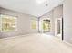 Spacious bedroom with large windows and plush carpeting at 4264 Braemere Dr, Spring Hill, FL 34609