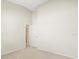 Spacious bedroom with neutral walls and access to a bathroom at 4264 Braemere Dr, Spring Hill, FL 34609