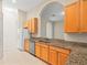 Well-equipped kitchen with ample cabinetry and granite counters at 4264 Braemere Dr, Spring Hill, FL 34609