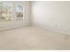 Large bedroom with neutral walls, carpeted floors, and two windows at 4264 Braemere Dr, Spring Hill, FL 34609