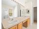 Double vanity bathroom with ample counter space and large mirror at 4264 Braemere Dr, Spring Hill, FL 34609