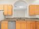 Kitchen boasts granite countertops and light wood cabinets at 4264 Braemere Dr, Spring Hill, FL 34609