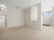 Bright living room featuring a view of the entryway and bathroom at 4264 Braemere Dr, Spring Hill, FL 34609