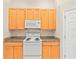 Eat-in kitchen with light wood cabinets and granite countertops at 4264 Braemere Dr, Spring Hill, FL 34609