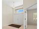 Bright and airy foyer with double doors, high ceilings, and access to other rooms at 4264 Braemere Dr, Spring Hill, FL 34609