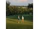 Couple enjoying a round of golf on a beautiful course at 6109 Dusk Rose Ln, Brooksville, FL 34601