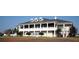 Grand clubhouse with beautiful landscaping at 6109 Dusk Rose Ln, Brooksville, FL 34601