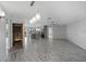 Open concept living room and kitchen with wood-look flooring at 6428 Driftwood Dr, Hudson, FL 34667
