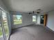 Main bedroom with water views and access to a balcony at 6428 Driftwood Dr, Hudson, FL 34667