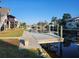 Private wooden dock extending into the waterway; perfect for relaxing and enjoying the water views at 6428 Driftwood Dr, Hudson, FL 34667