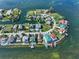 Aerial view of waterfront home on a secluded island with private dock at 6428 Driftwood Dr, Hudson, FL 34667
