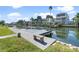 Private dock with a bench overlooking a peaceful canal at 6428 Driftwood Dr, Hudson, FL 34667