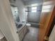 Clean bathroom with a bathtub, toilet and sink at 6428 Driftwood Dr, Hudson, FL 34667