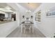 Bright dining room with a table and chairs, adjacent to the kitchen at 313 Crystal Beach Ave, Crystal Beach, FL 34681