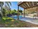 Inviting pool area with patio furniture and hot tub at 313 Crystal Beach Ave, Crystal Beach, FL 34681