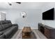 Living room with dark leather couch and coffee table at 12894 Impatiens St, Spring Hill, FL 34609