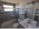 Updated bathroom with a tub, shower, and modern vanity at 3544 Wilson Dr, Holiday, FL 34691