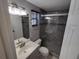 Modern bathroom with tiled shower, updated vanity, and stylish fixtures providing a luxurious feel at 3544 Wilson Dr, Holiday, FL 34691