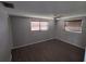 Spacious bedroom with laminate wood flooring and window blinds at 3544 Wilson Dr, Holiday, FL 34691