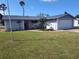 Charming single-story home with a well-maintained lawn and neat landscaping at 3544 Wilson Dr, Holiday, FL 34691