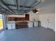 Garage with workspace, shelving, and laundry hookups at 3544 Wilson Dr, Holiday, FL 34691